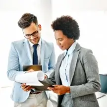 colleagues reviewing documents together