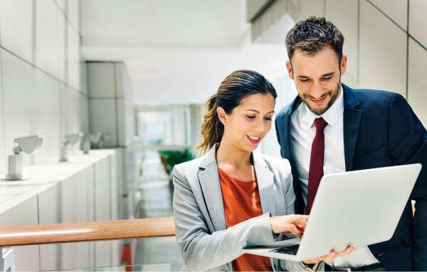 professionals reviewing laptop content